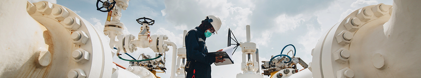 engineer inspecting steam pipes 