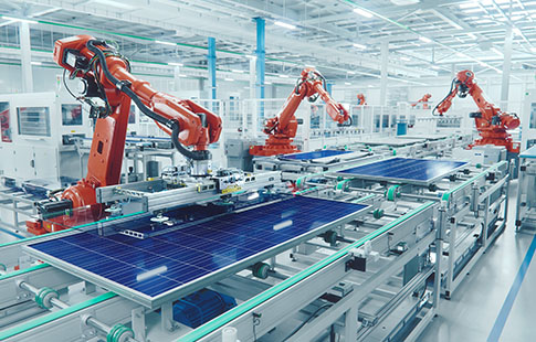 Industrial Robot Arm at Production Line. Solar Panels are being Assembled on Conveyor.